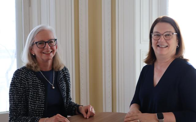 Dr. Jane Philpott and Dr. Diane Lougheed sitting at a table